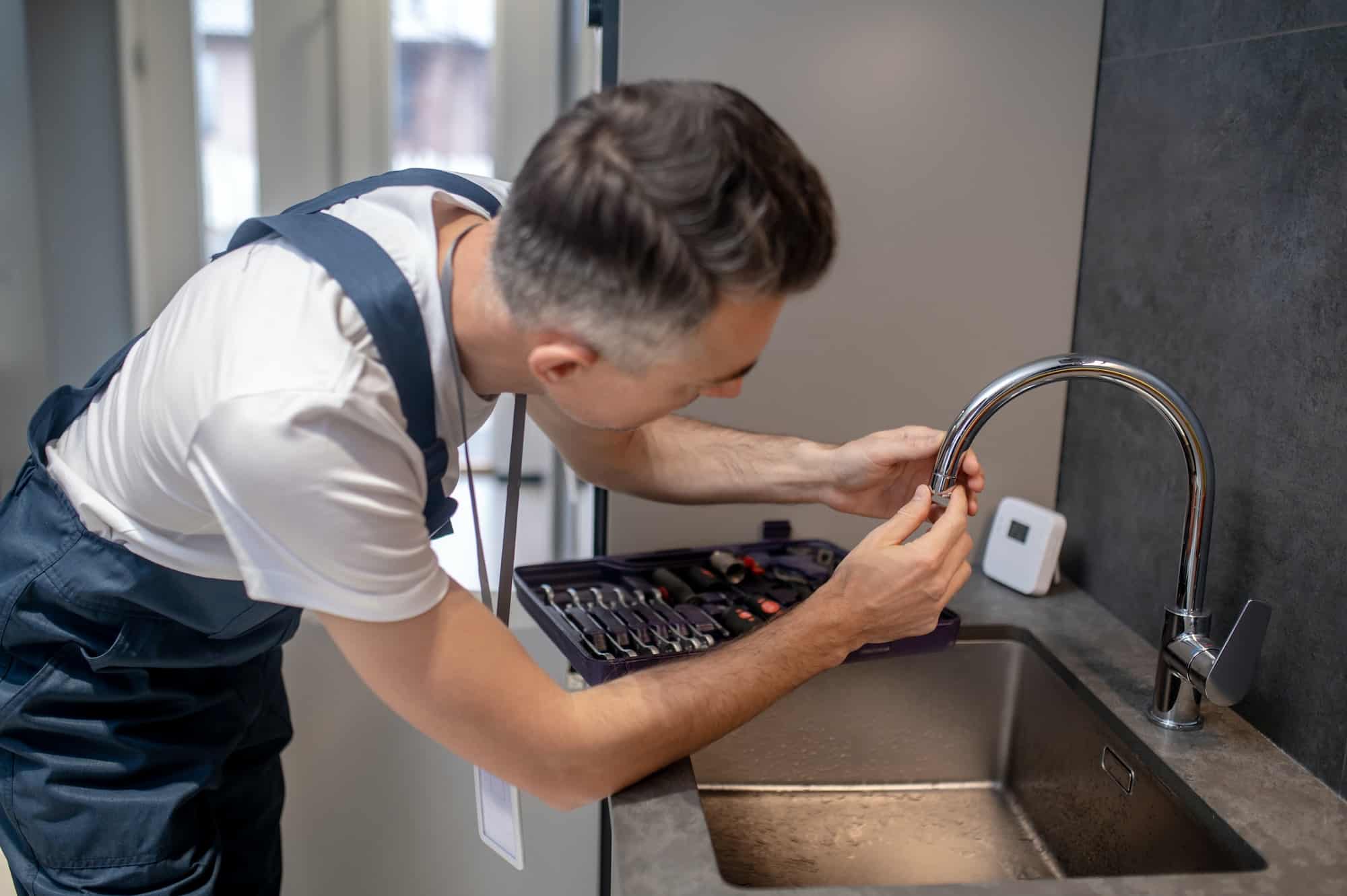 Dependable Appliance Repair Tucson 41 dependable appliance repair tucson man spinning faucet aerator on spout pipe